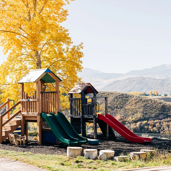 Children playing outside at the Woody Creek location
